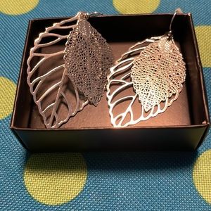 Avon layered in leaves silvertone earrings.